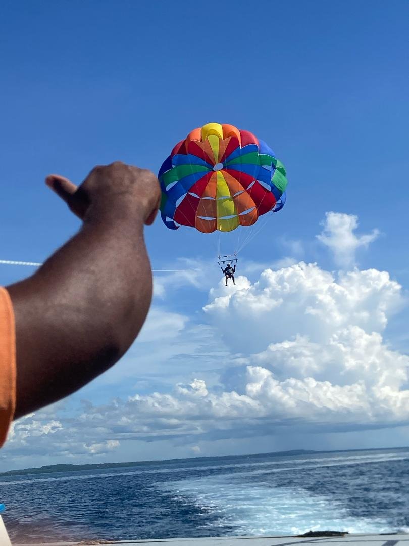 Rainbow parachute soaring above the Indian Ocean
