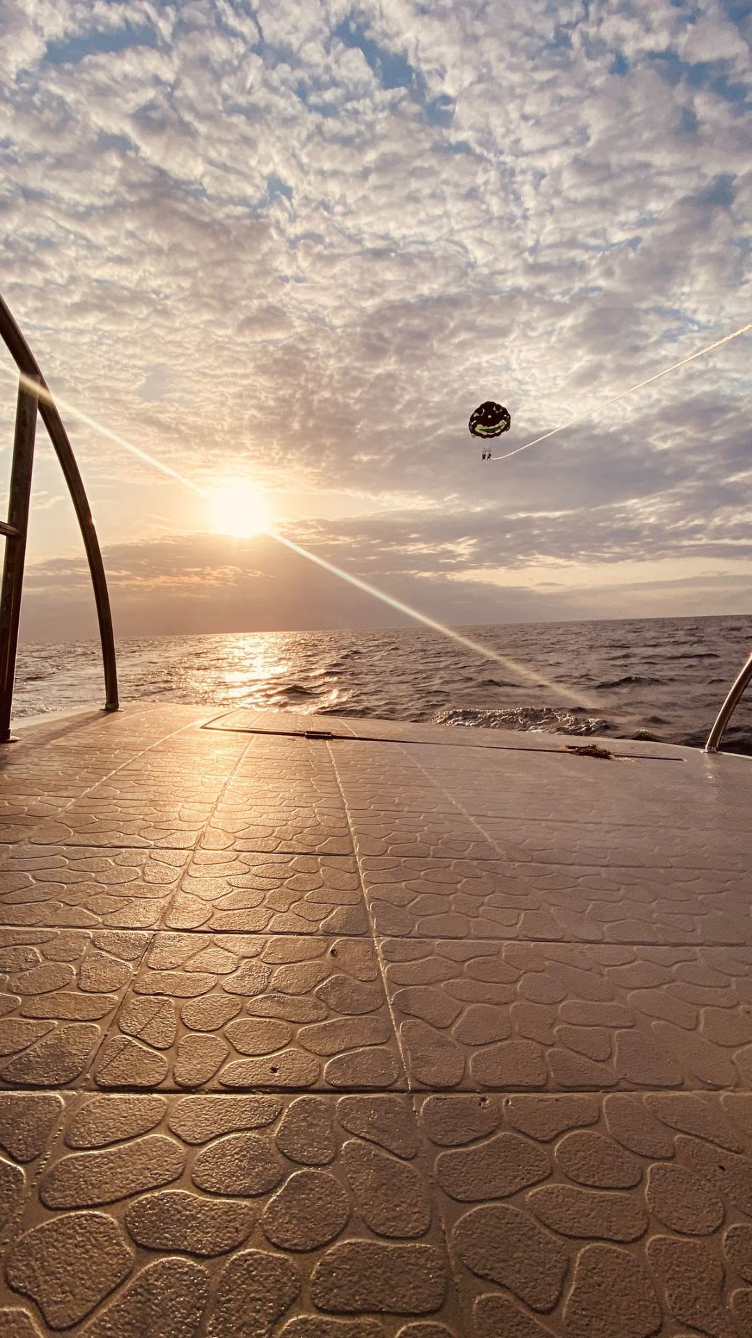 Parasailer at sunset above Zanzibar's ocean